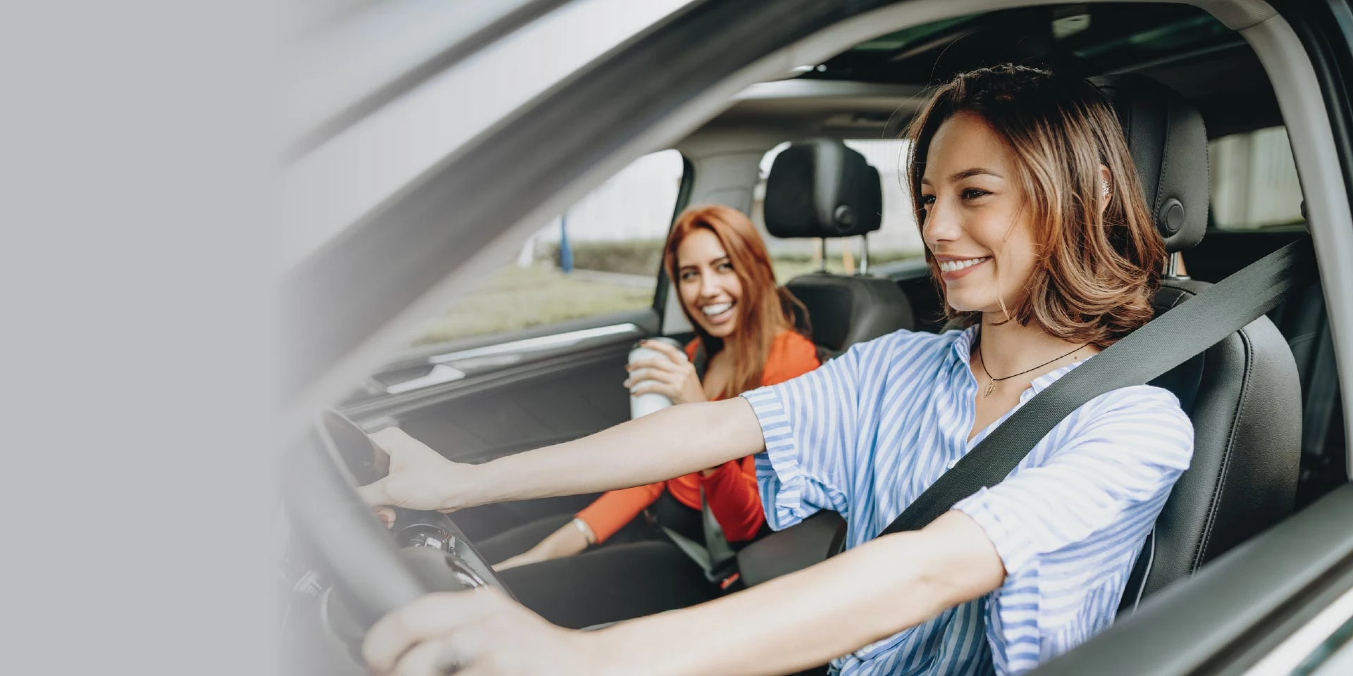 Two friends out driving to another friend's house