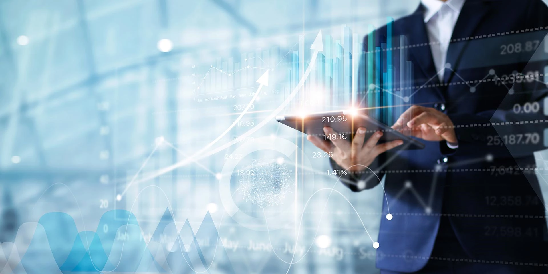 A businessman is working on a tablet while reviewing stocks and his investment management plan