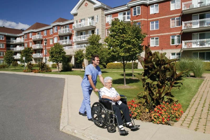 A caretaker and resident out for a walk