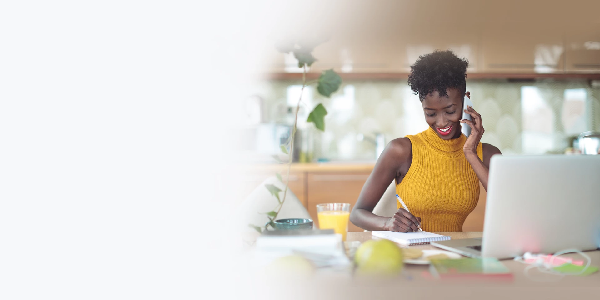 Woman on her phone taking notes