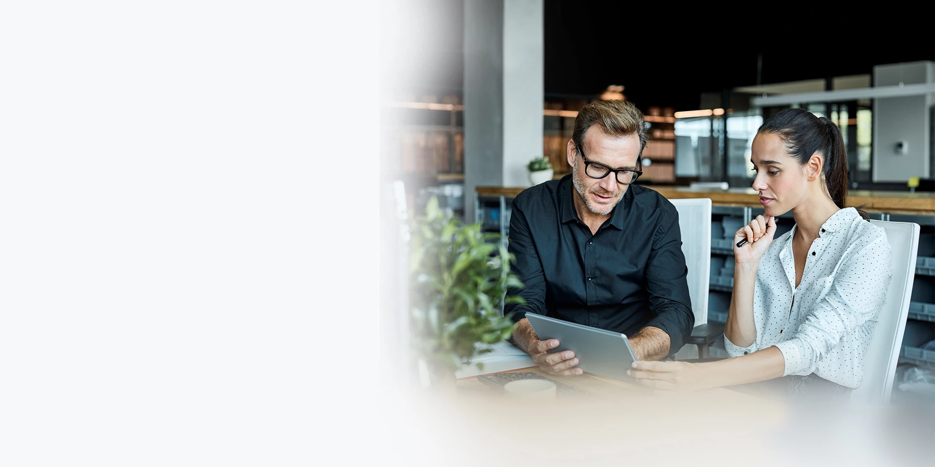 A couple looking at financial stories