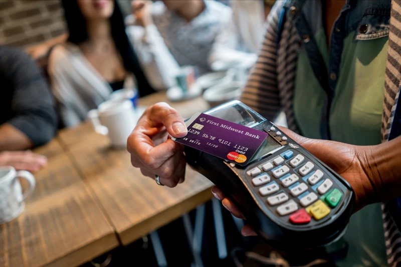 A client paying with there First Midwest Debit Card