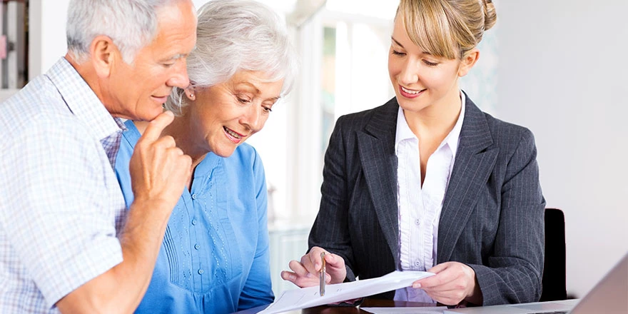 A woman reviewing investment strategies with her client