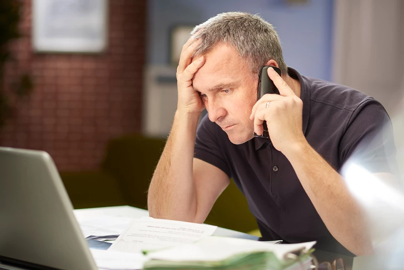 A consumer on a call with their IT department