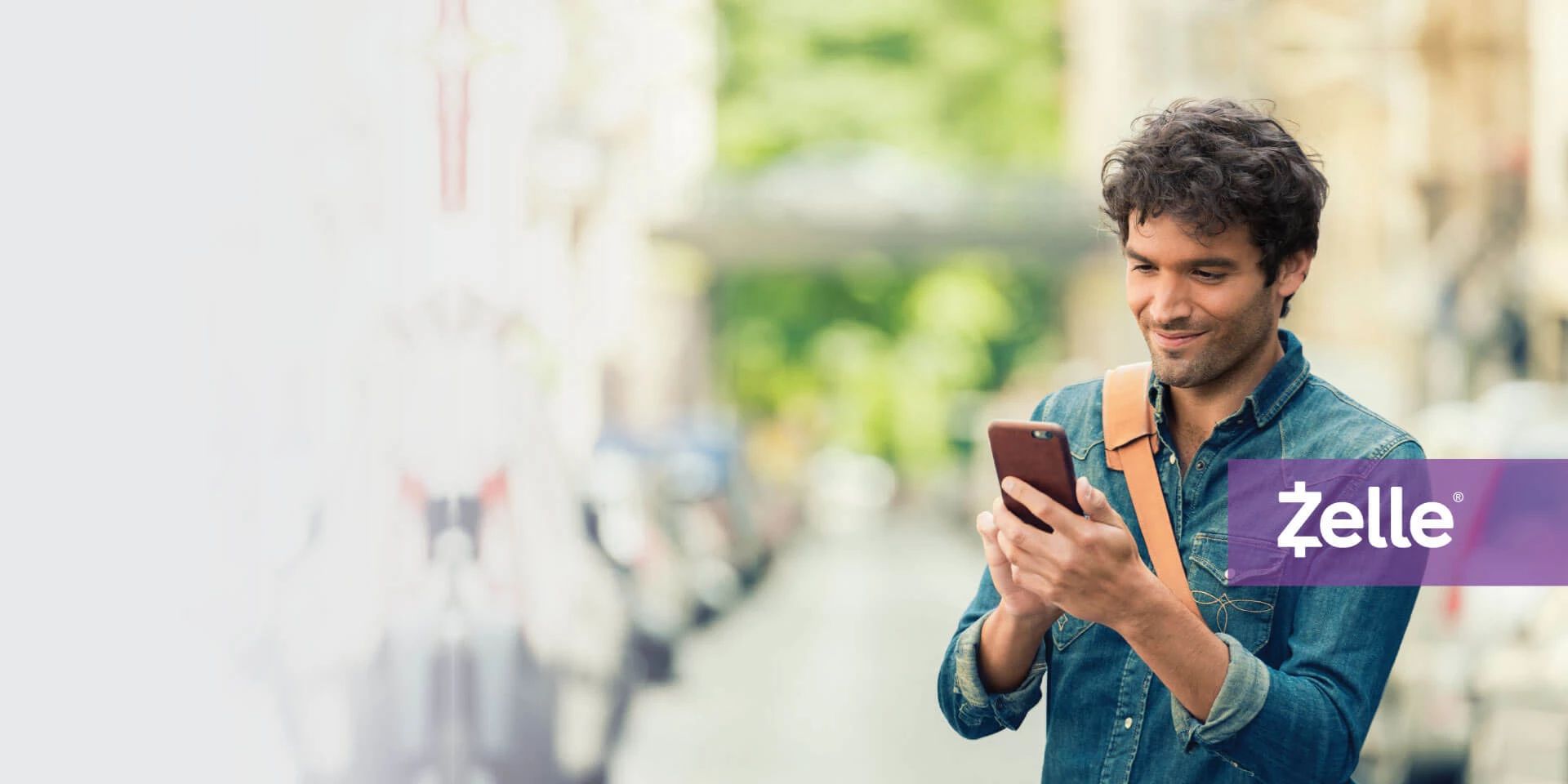 A man enrolling in Zelle on his mobile device