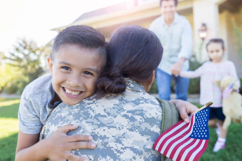 A mom hugging her son