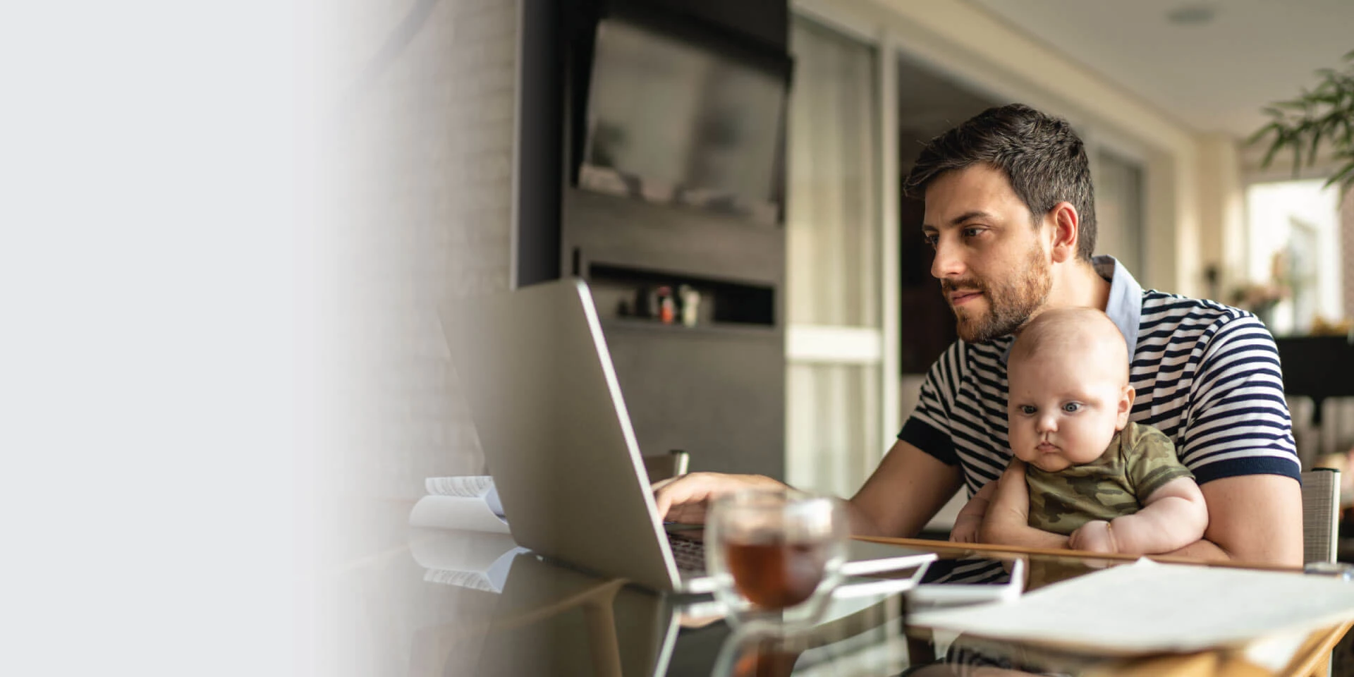 A father and his son working on a laptop