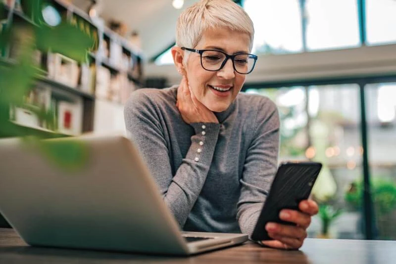 A woman logging into Mobile Banking