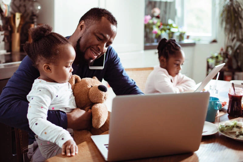 A father savings money in a Build-a-Buck for his daughter's party