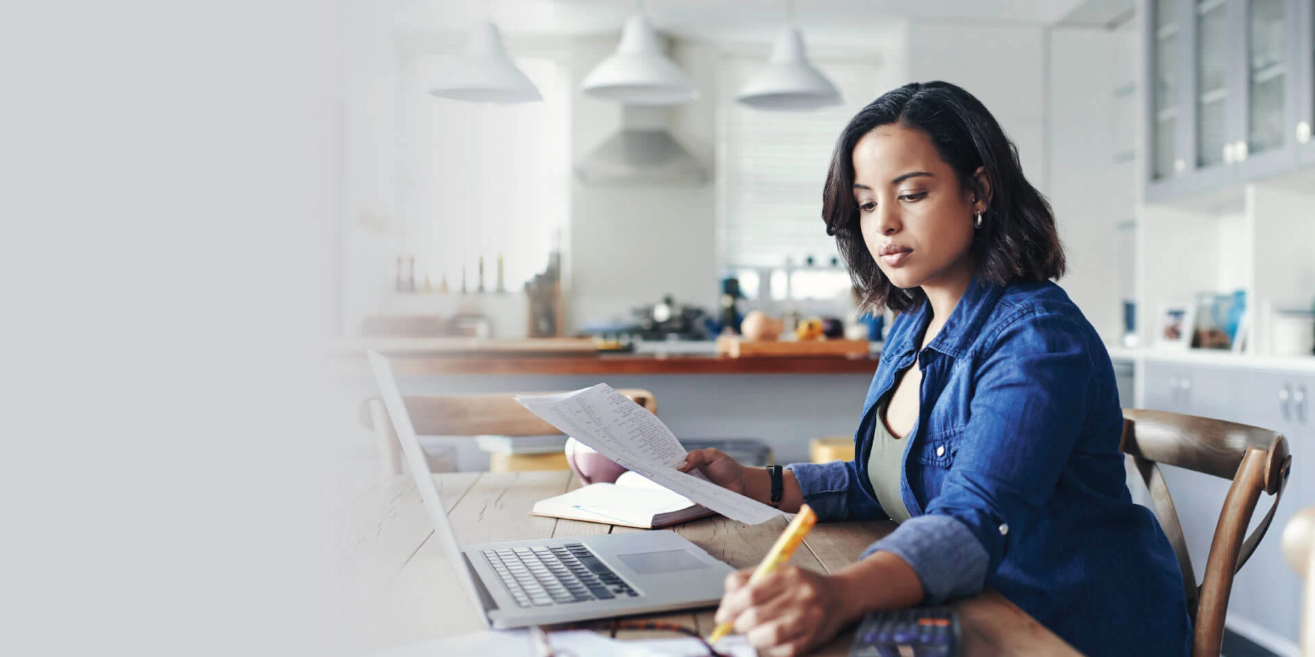 A woman looking through her finances