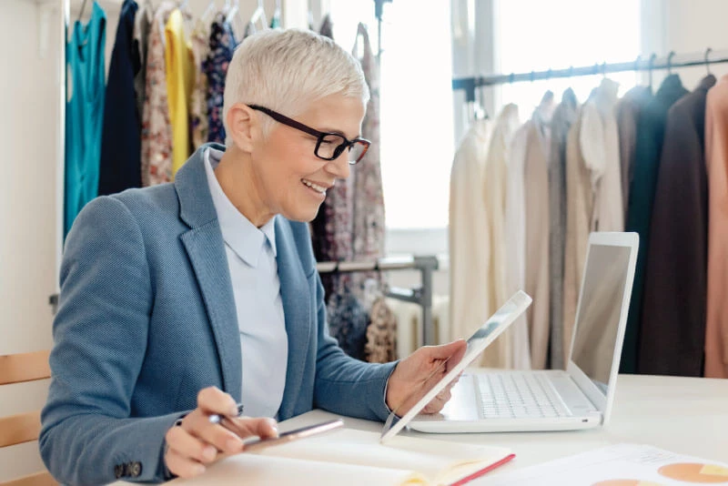 A small business owner working on her laptop