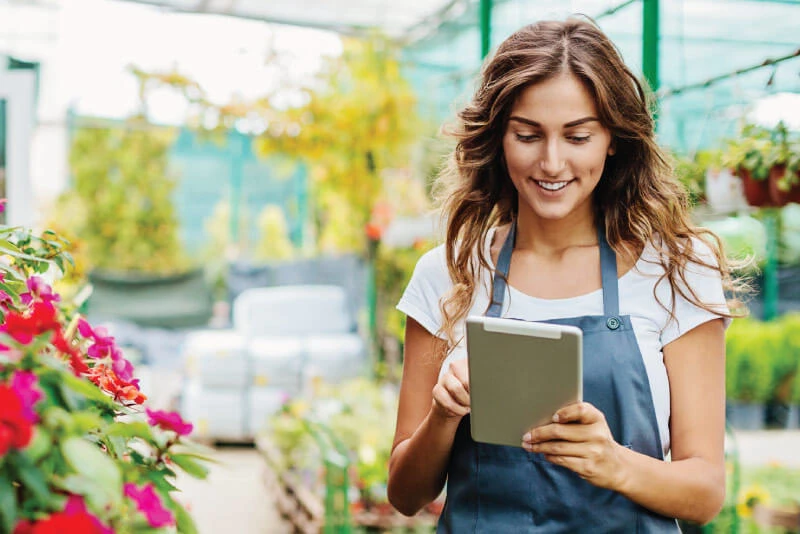 A small business owner checking her online banking