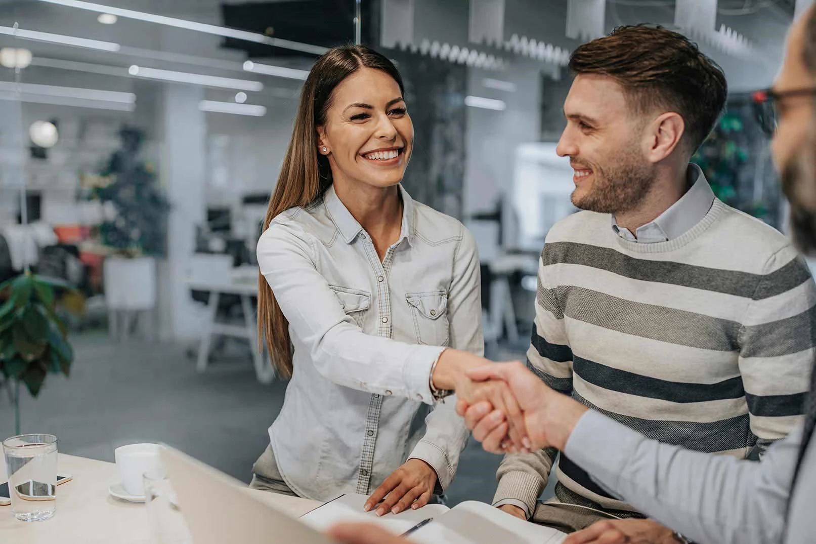 A young couple reviewing financial documents