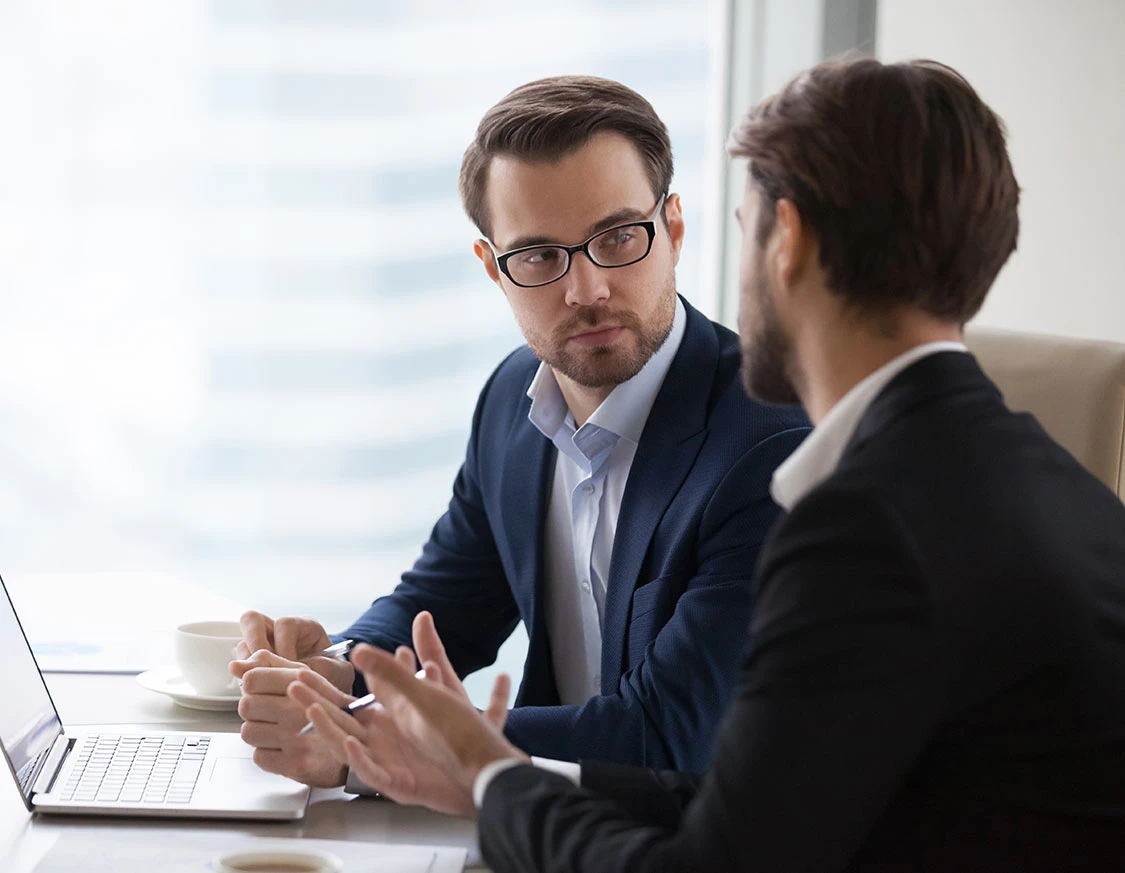 Two people discussing Fiduciary Services