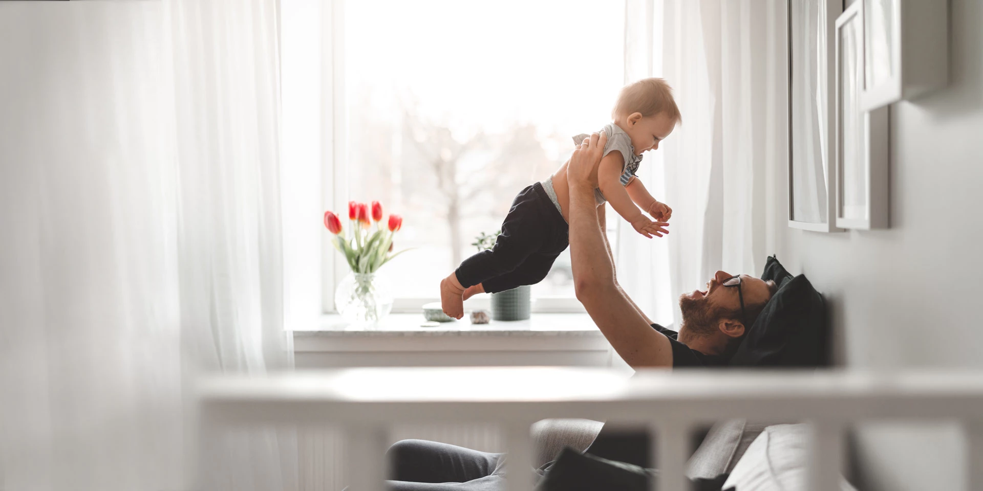Dad holding his son in the air